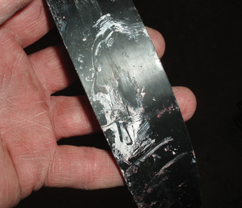 Photo 4: The contamination on the flat side of this timing belt came from a leaking water pump.